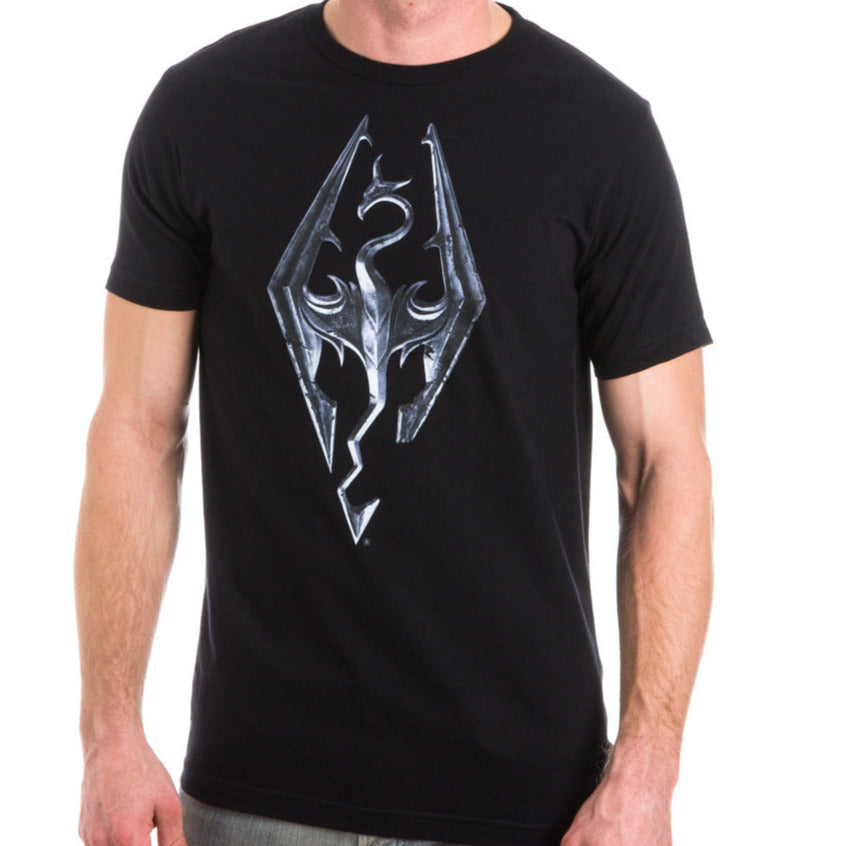 Image of a man wearing an Elders Scroll V black shirt with the Dragon born logo