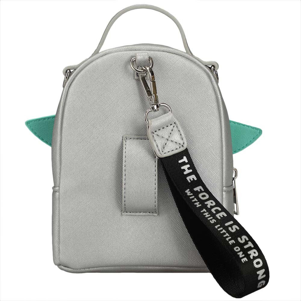 Closeup view of the back of a mini travel bags silver with a Grogu vinyl applique on front and a belt and wristlet hanger on the back